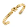 Edblad Swivel Bangle Gold – elegant guldpläterat armband i minimalistisk design