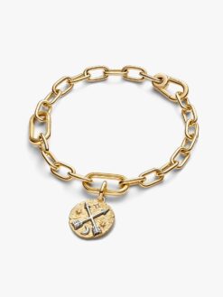 Närbild på Pandora korsande pilar medaljong – kubisk zirkonia och tvåtonig guld-silver finish